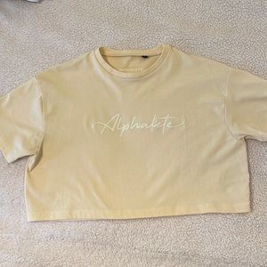 Alphalete yellow crop top - size small